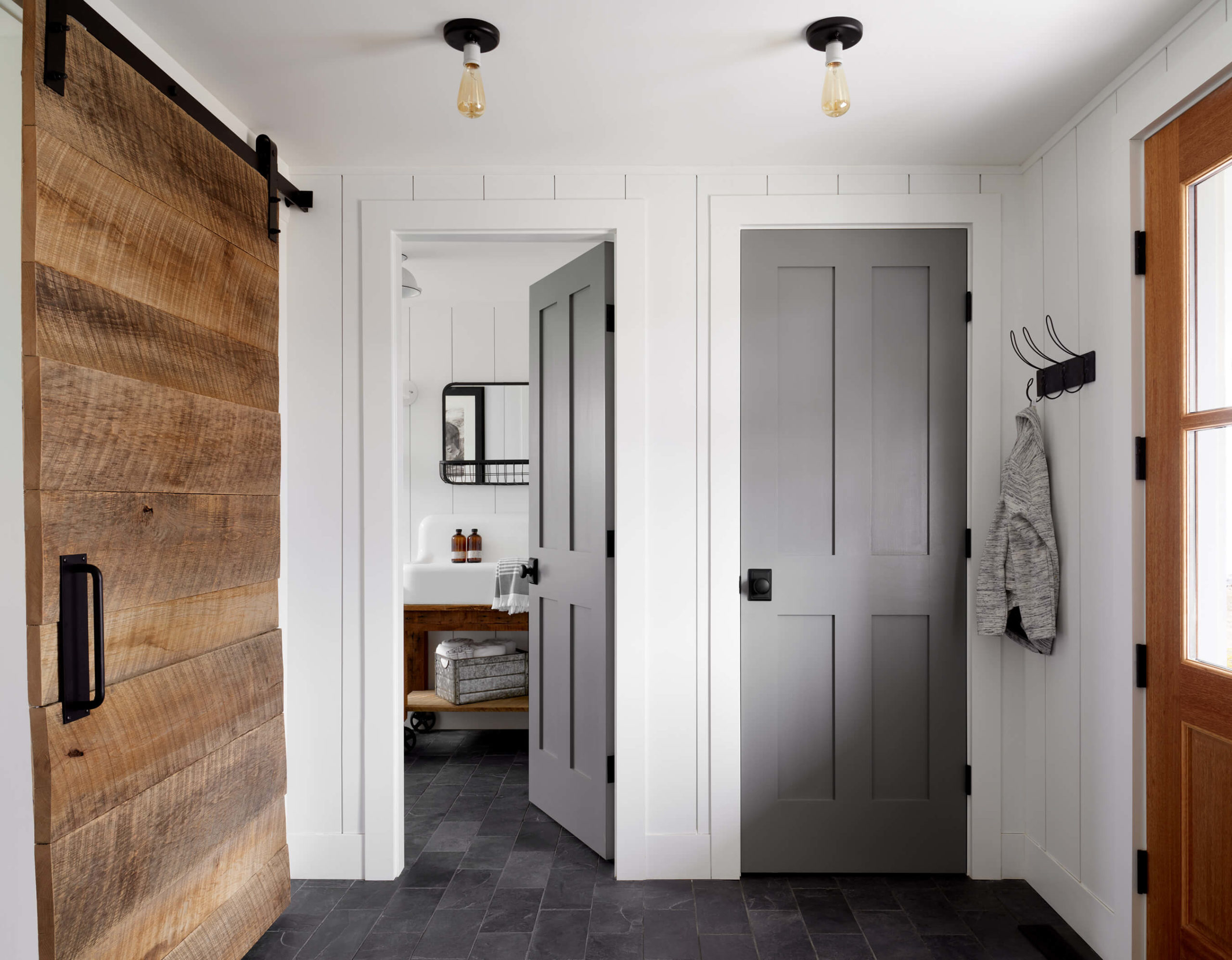 Farmhouse interior, modern farmhouse mudroom, modern farmhouse entry, vertical shiplap, shiplap to ceiling, shiplap in mudroom, vintage mirror, slate floor, slate floor mudroom, Kristina Crestin , Kristina Crestin Design, HGTV Farmhouse Fixer, HGTV Farmhouse , HGTV Jonathan Knight, Farmhouse Renovation, modern farmhouse style