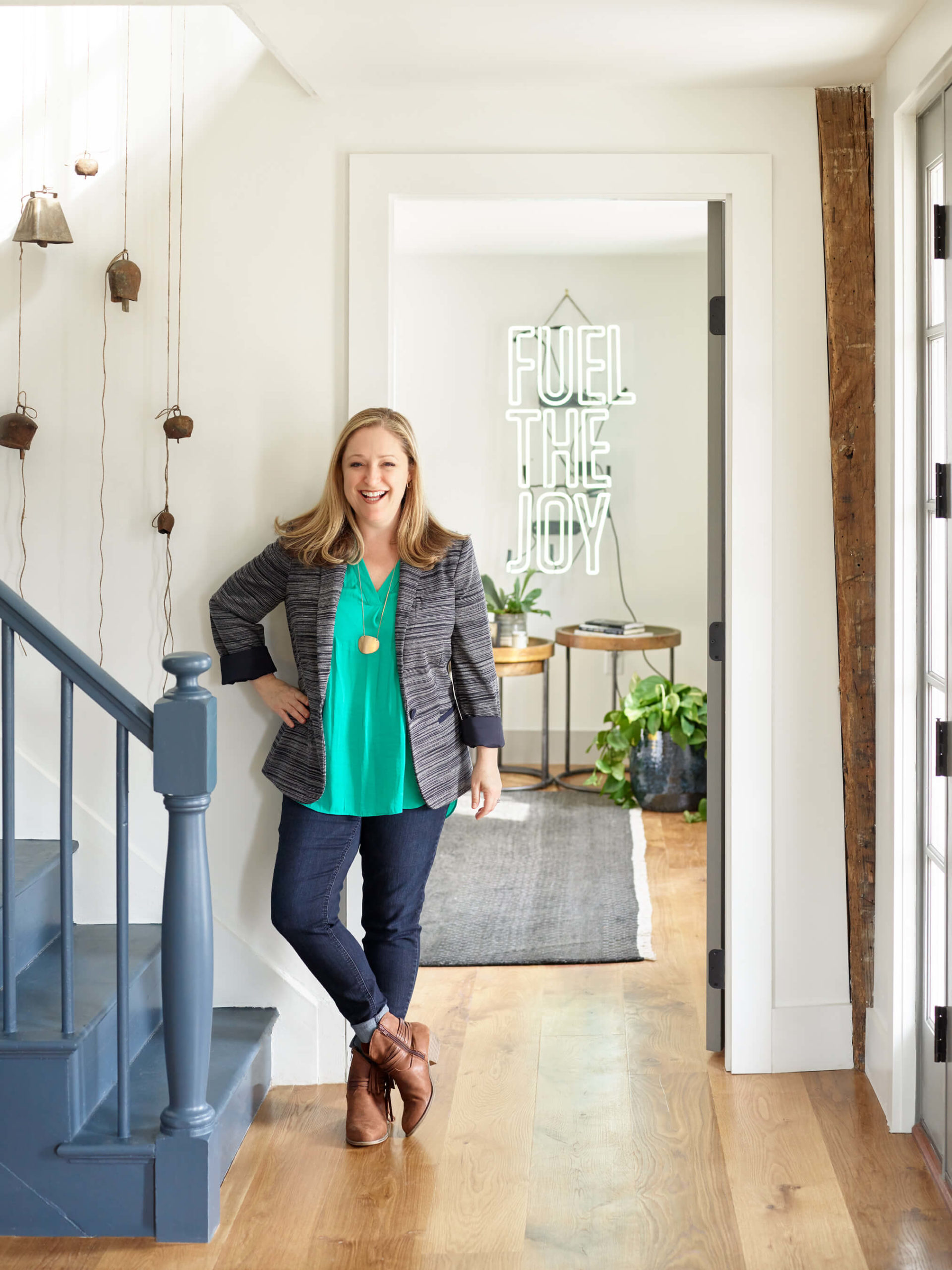 Farmhouse interior, front entry, front entry renovation, wall lights, wall sconce, blue stairs, sherwin williams paint, wood floors, carpet, bedroom rugs, rugs, floor plants, neon sign, fun neon sign, wood tables, wood nightstands, nightstands, cow bells, interior design blog, design blog