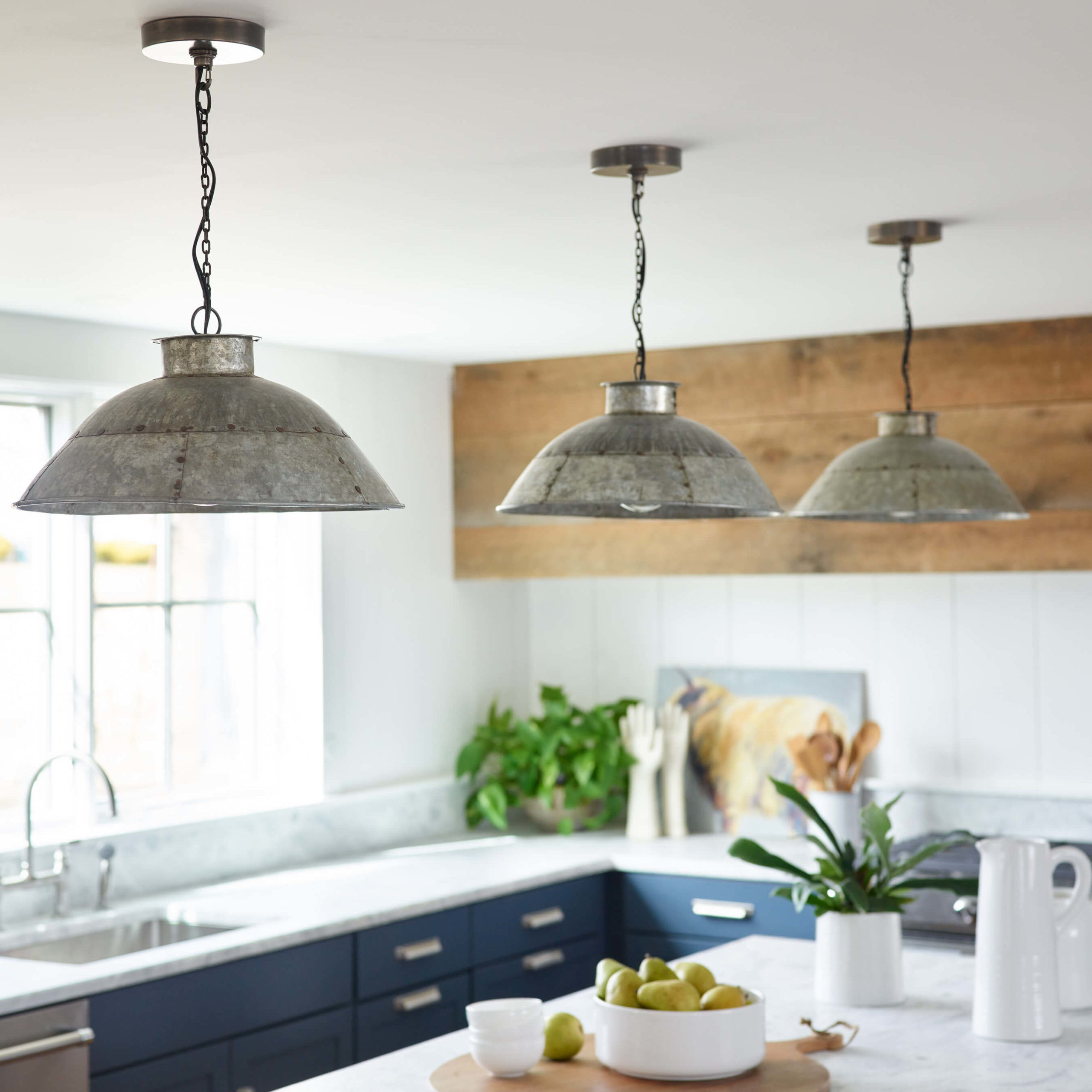 galvanized lighting, Reclaimed Wood Island, Reclaimed Wood vent hood, Blue Kitchen, blue cabinets, salvaged lighting , industrial lighting, farmhouse with industrial lighting, farmhouse shiplap walls, shiplap walls, white oak flooring, wide oak flooring, West Elm Slope stool, Parq faucet, Kohler Parq, white quartzite, quartzite counters, custom barn wood island , barn wood island, wood vent hood, reclaimed wood vent hood, Kristina Crestin